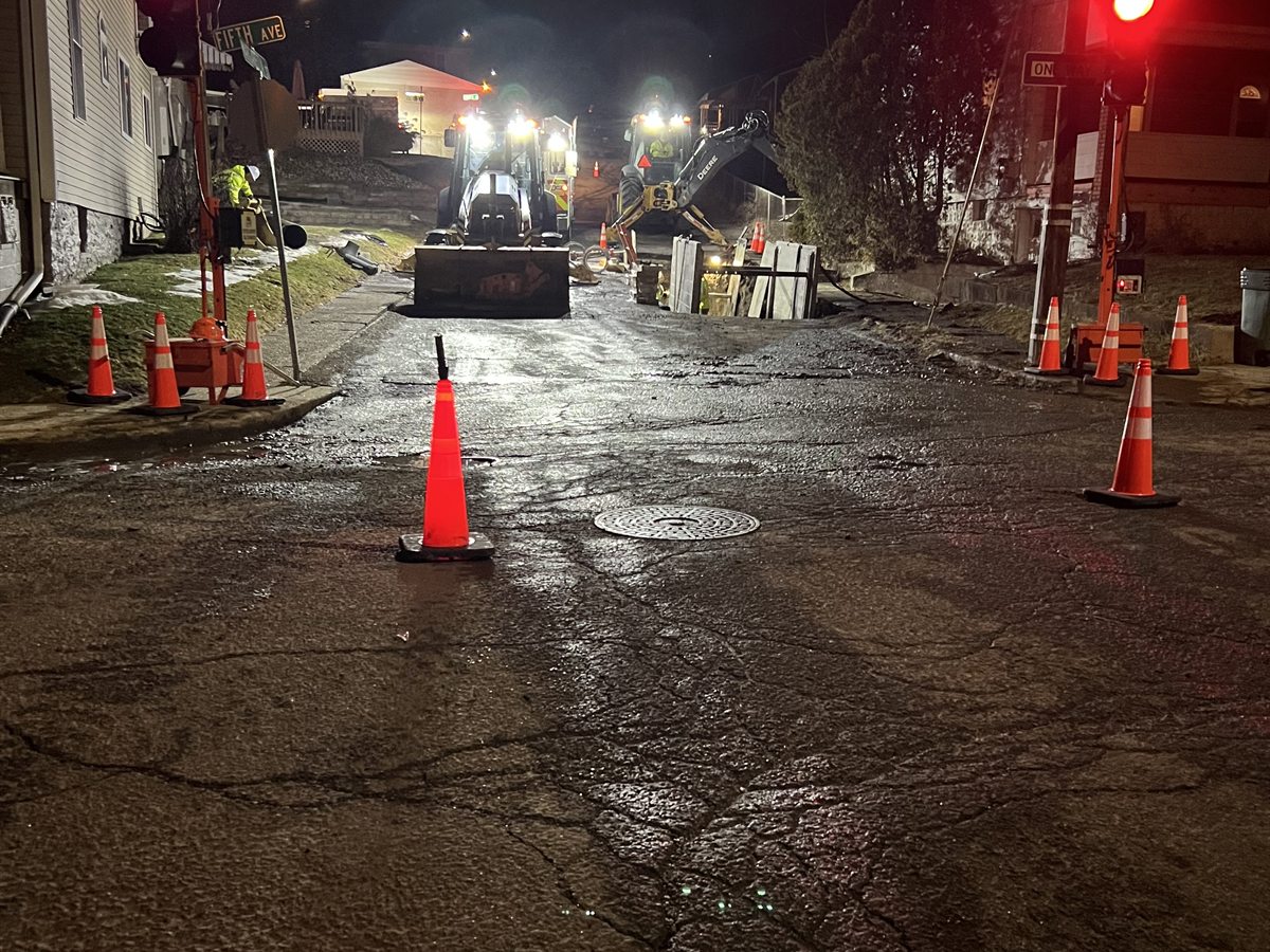 Road work equipment inside a night lane closure